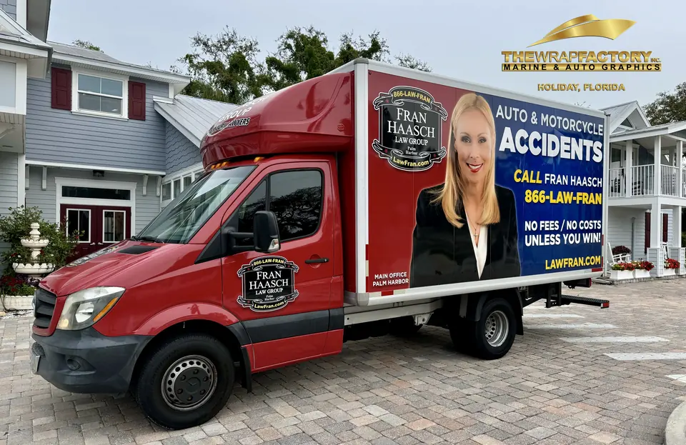 Red box truck with a full commercial wrap for an accident law firm