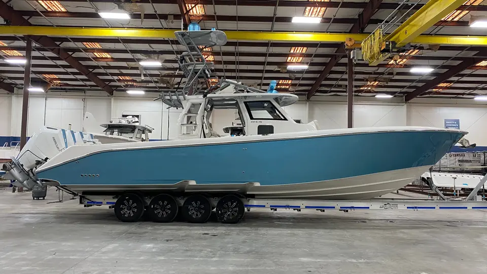 Light-blue center console on a trailer before paint protection film