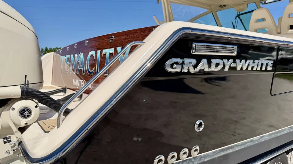 Grady-White transom with Tenacity lettering on a dark wrap