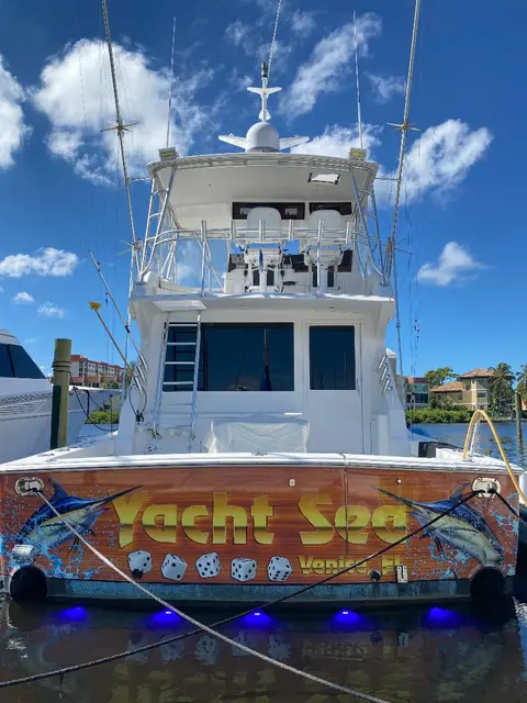 Sportfish transom wrapped in faux teak with Yacht Sea marlin artwork, Venice, FL